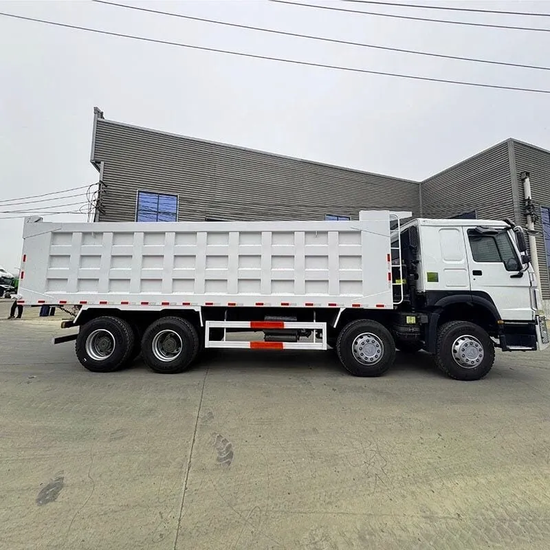 SHACMAN M3000 8x4 dump truck with raised tipper body at a quarry site