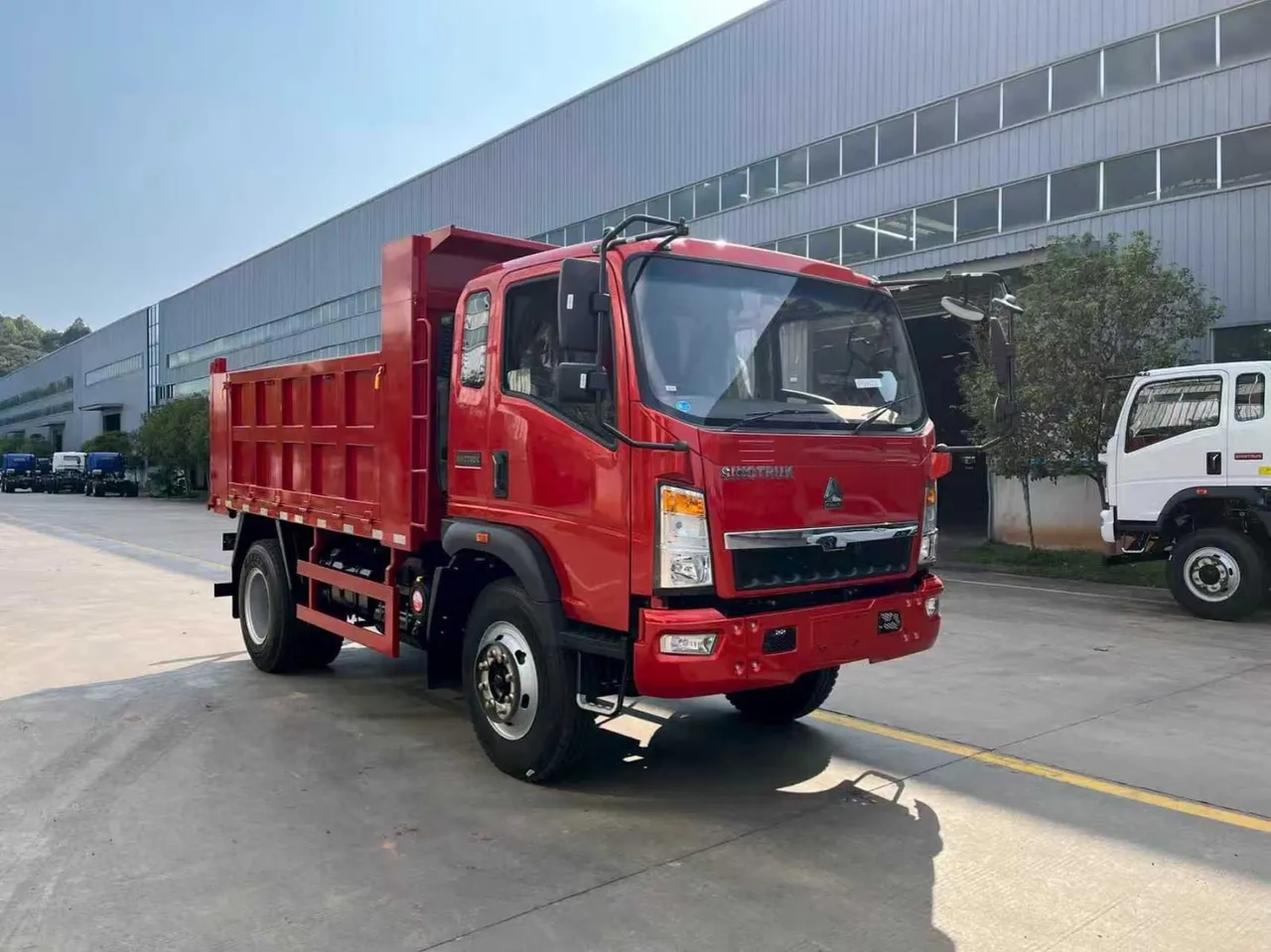 Used 6 ton tipper truck ready for export — white HOWO 4x2 light dump truck on inspection yard