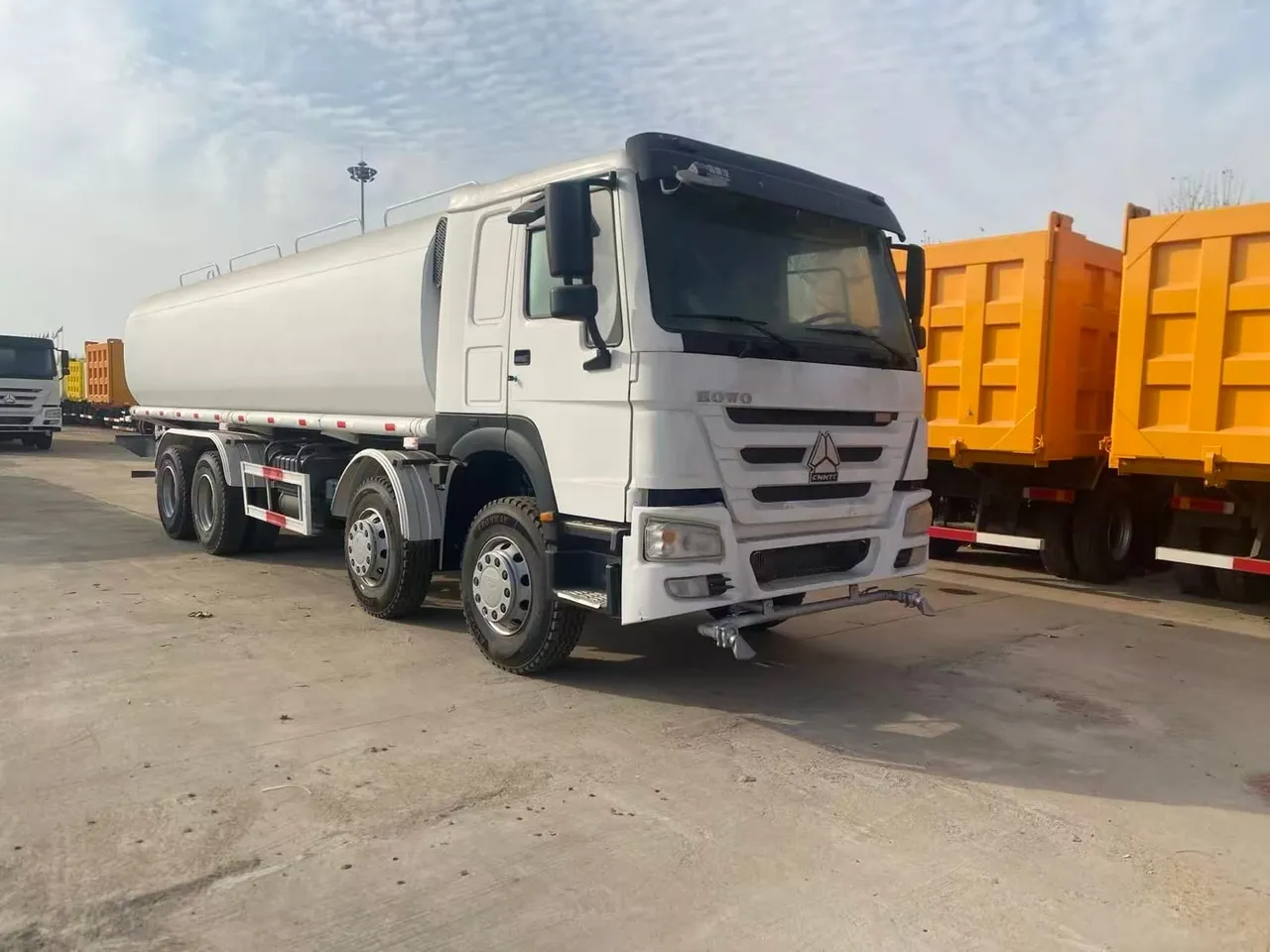 Used HOWO 8x4 water tanker truck with rear spray bar, ready for export
