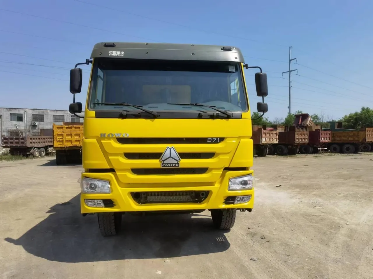 Used 10-wheeler 6x4 dump truck on gravel road at quarry