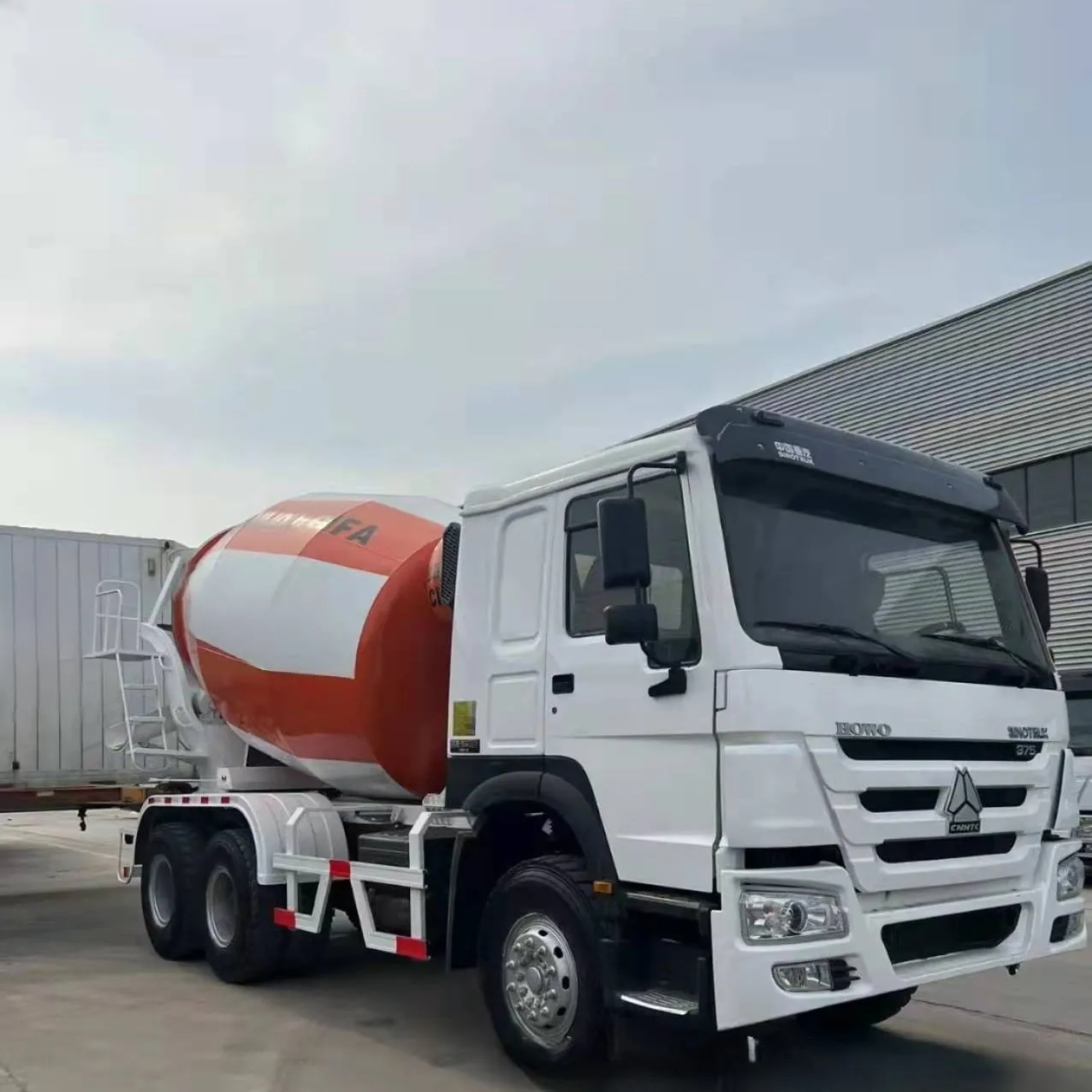 Used HOWO 6x4 concrete mixer truck, orange rotating drum, 371HP, export ready