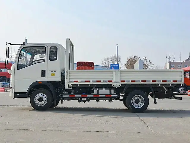 Light HOWO flatbed truck at China export yard, inspected and export ready