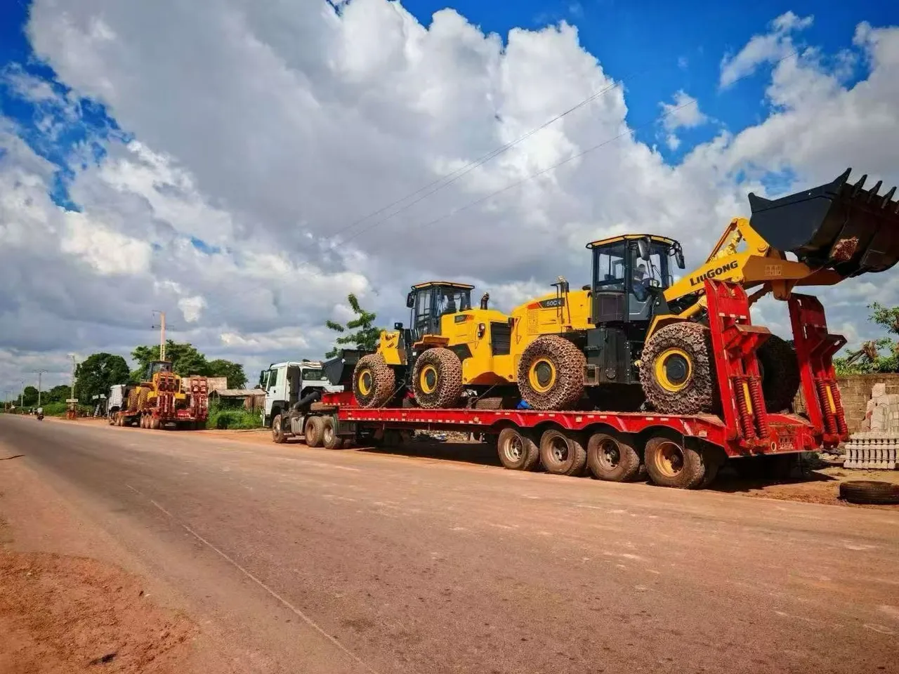 Used flatbed semi-trailer loaded with steel pipes for export